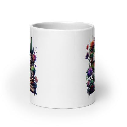 White glossy mug side view with partial “BOOKS plants & COFFEE” print