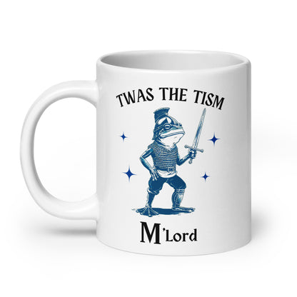 White glossy mug with blue knight sword graphic, 'Twas the Tism' and 'M'Lord' print