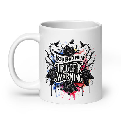 White glossy mug with black roses and 'Trigger warning' text graphic