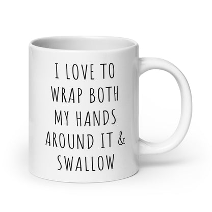 White glossy ceramic mug with black quote: I LOVE TO WRAP BOTH MY HANDS AROUND IT
