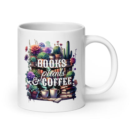 White glossy mug front with colorful “BOOKS plants & COFFEE” floral shelf design