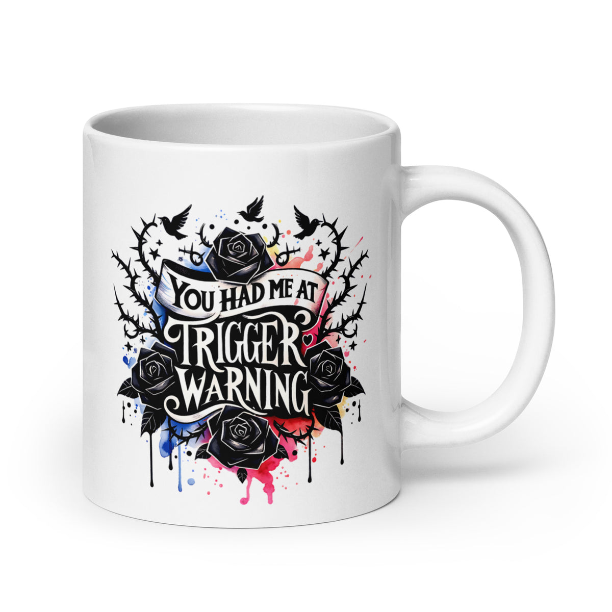 White glossy mug with colorful splatter roses and 'Trigger warning' text
