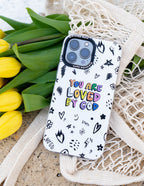 Christian iPhone Case with colorful 'You Are Loved By God' design surrounded by floral doodles