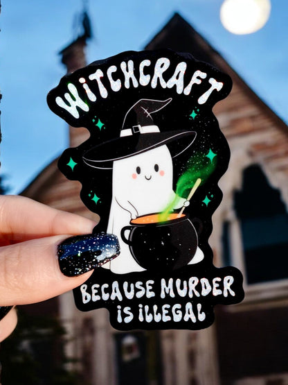 Funny Black Halloween witch sticker with green potion and text 'Witchcraft' 'Murder Is Illegal'