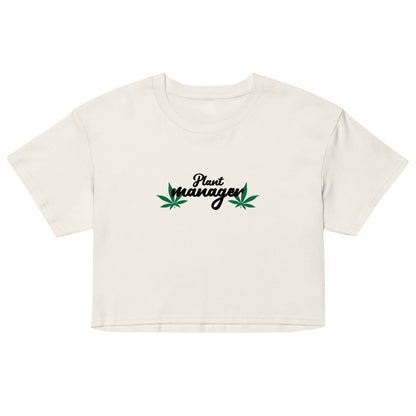Women’s white crop top with “Plant Manager” plant graphic on front