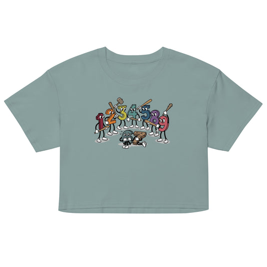 Women’s crop top in dusty teal with colorful cartoon number character graphic at center
