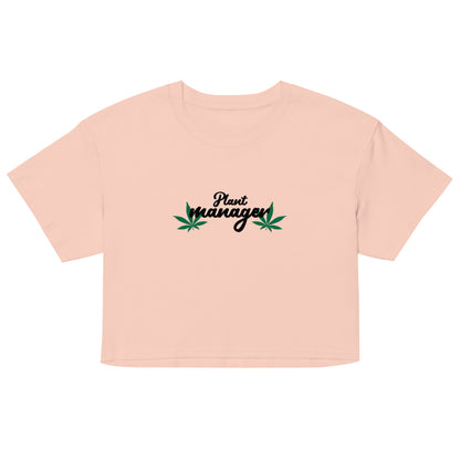 Women’s light peach crop top with “Plant Manager” plant graphic on front