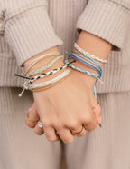 Colorful Elevated Faith Christian Jewelry Bracelet stack worn on hands with various styles