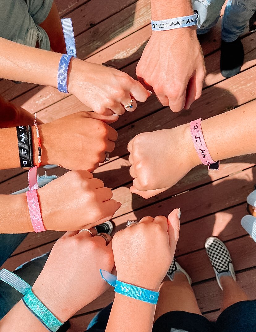 Colorful Elevated Faith Christian Jewelry Bracelet worn by multiple people showcasing community and faith