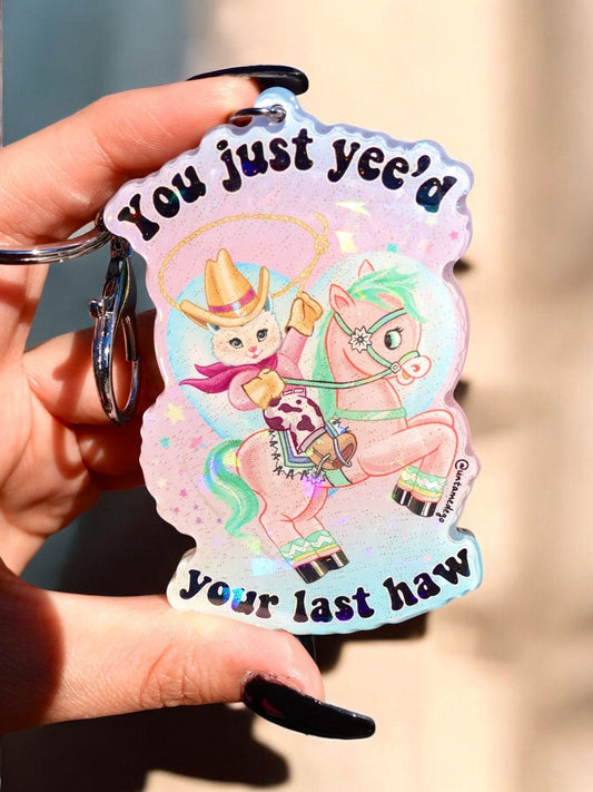 Funny Holographic kitty keychain with pastel rainbow graphic, text, and metal keyring